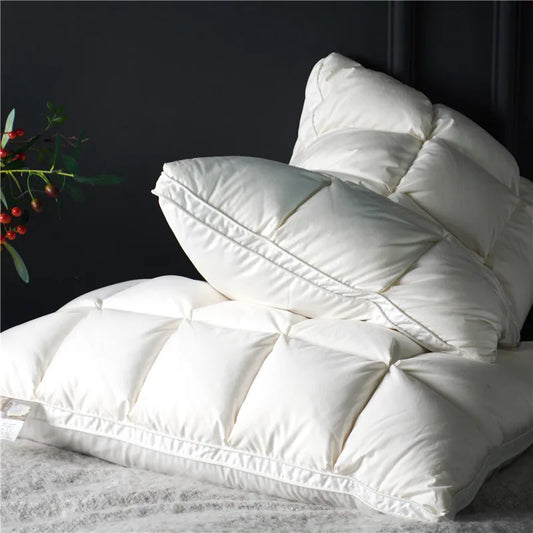 White goose down pillow set on minimalist bed with clean Japandi interior