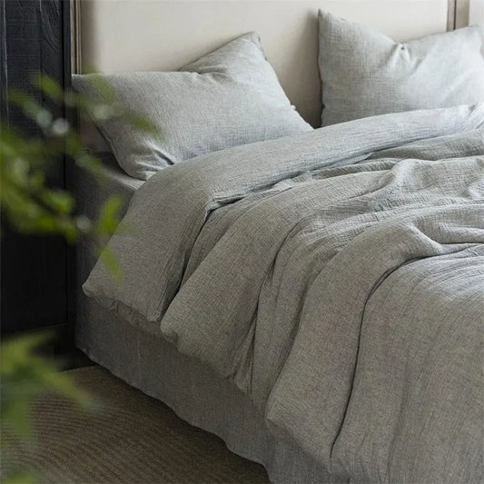 Neutral linen bedding styled in calm modern bedroom interior