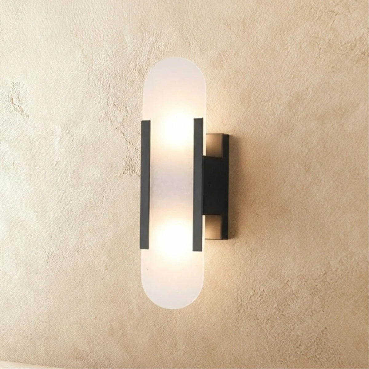 Alabaster wall lamp mounted on wall with natural stone surface