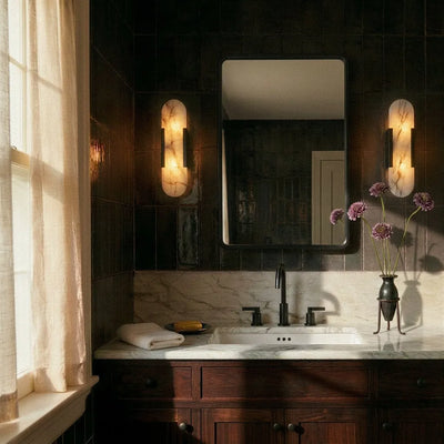 Side view of alabaster wall lamp with metal support frame